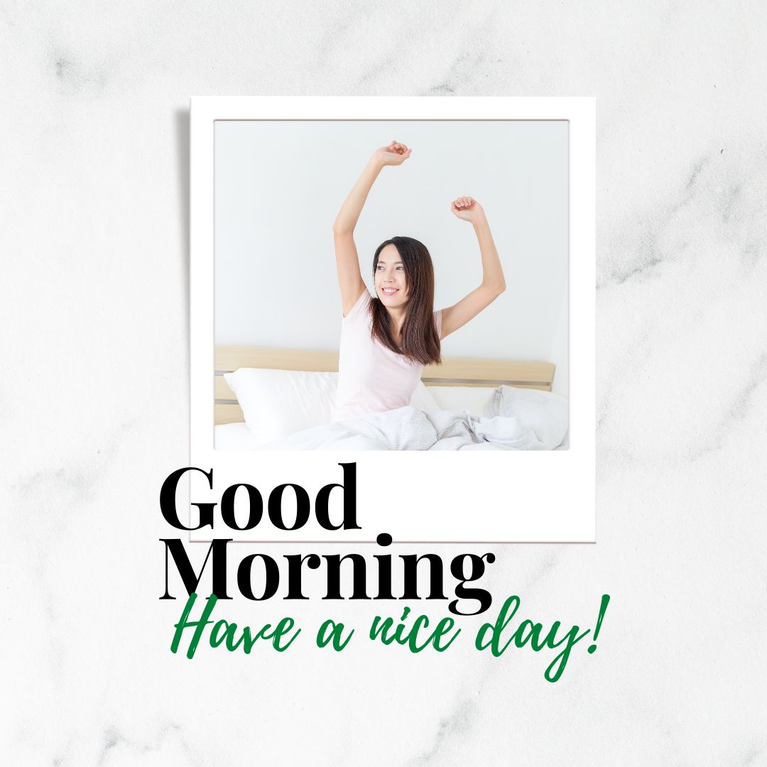 A woman, wearing a white shirt, is stretching her arms upwards while smiling on a bed. The backdrop features a marble texture with the text "Good Morning" in bold black letters and "Have a Nice Day!" in cheerful green italics at the bottom of the image.