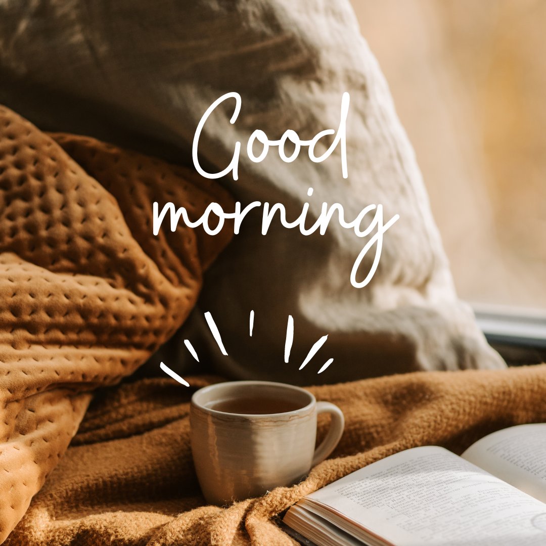 Good morning tea image featuring a cozy morning scene with a cup of tea set on a mustard throw blanket beside a cushion and an open book, under a warm, softly lit window.