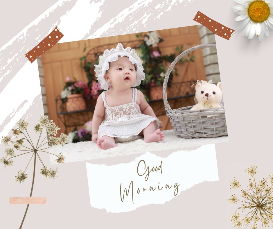 A baby boy in a white dress and bonnet sits next to a basket with a plush bear, surrounded by flowers. The photo is framed with floral and polka dot tape accents. The words "Good Morning" are written beneath the image. Perfect for those looking for Good Morning Baby Images in HD.