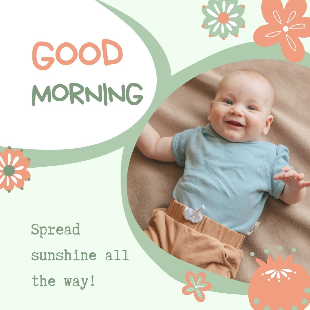 A smiling baby in a blue shirt and brown pants lies on a beige surface. The image, perfect for Good Morning Baby Images HD, is decorated with orange and green flowers and features text that reads "GOOD MORNING" and "Spread sunshine all the way!" in a playful font.