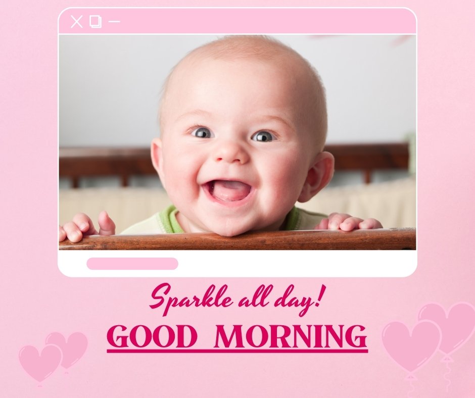 A smiling baby boy is seen peeking over a surface, framed by a computer window graphic. The background is pink with heart illustrations. The text above the baby reads "Sparkle all day!" and below it says "GOOD MORNING" in cheerful, bold letters. Perfect for Good Morning Baby Images HD!