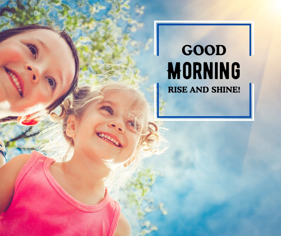 Good Morning Baby Images featuring two joyful children smiling under a sunny sky with the caption 'Good Morning Rise and Shine!' framed against a backdrop of bright blue sky and lush trees.