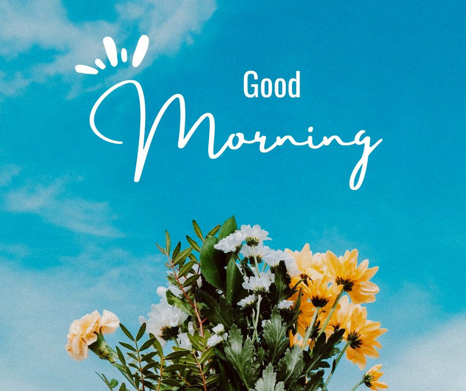 Good morning nature image showcasing a bouquet of fresh, vibrant flowers with daisies and chrysanthemums against a clear blue sky, with the greeting 'Good Morning' playfully scripted above.