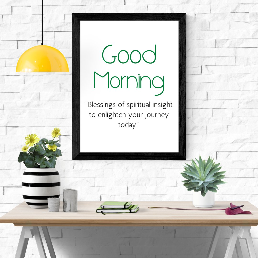 Good morning blessings image displayed in a modern home setting, featuring a framed quote on a white brick wall, accompanied by a yellow pendant lamp and a stylish desk with potted plants and notebooks, evoking a sense of spiritual insight for the day.