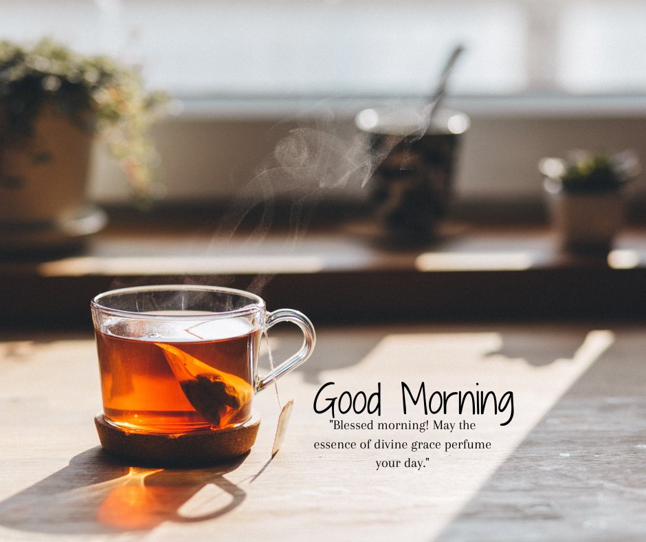 Good morning blessings image featuring a steaming cup of tea on a wooden table, illuminated by sunlight, with indoor plants in the background, accompanied by a quote about divine grace perfuming the day.