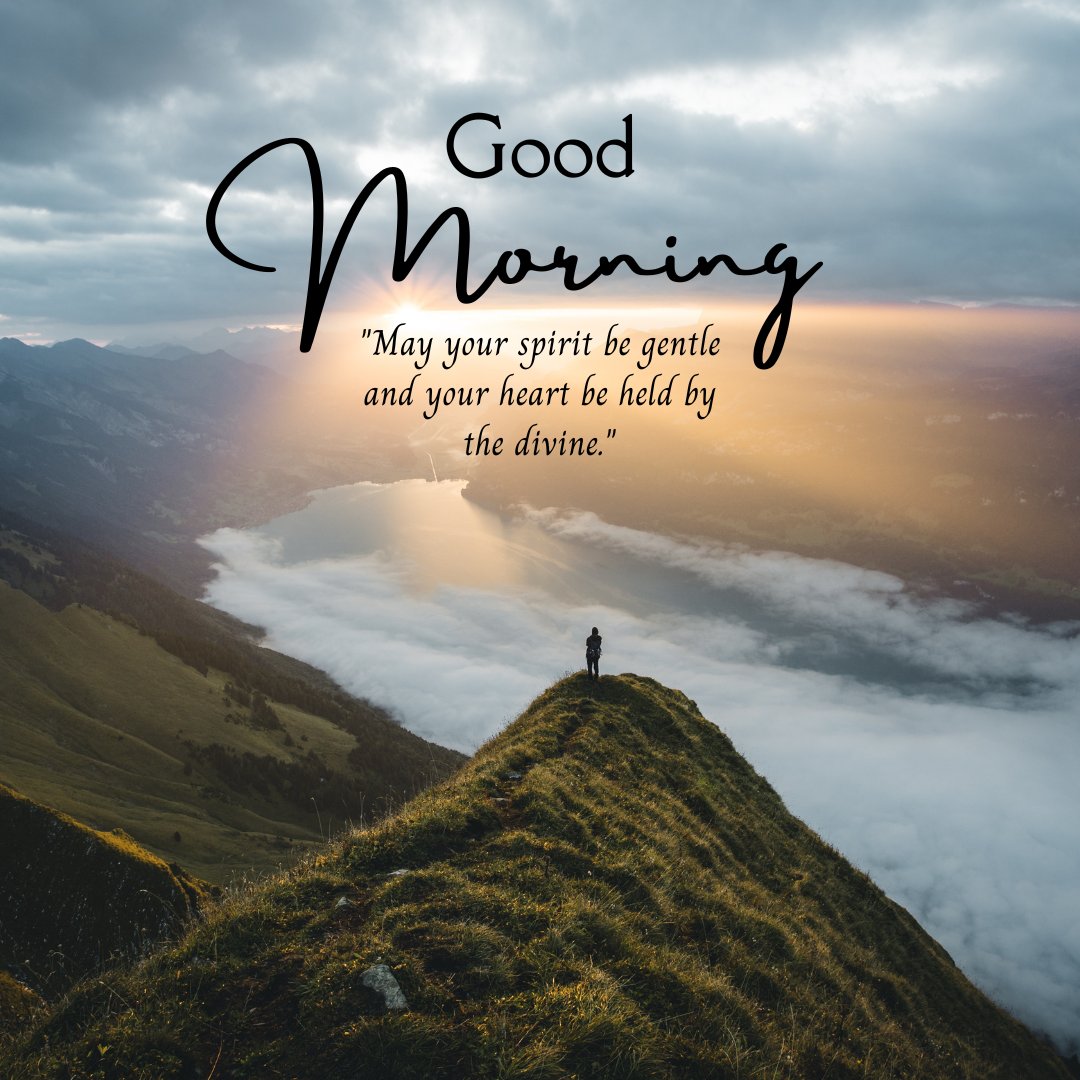 Good morning blessings image showcasing a breathtaking mountain landscape at sunrise with a lone person standing on a peak, conveying a message of spiritual gentleness and divine support.