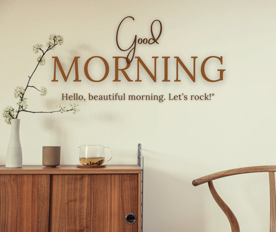 Good morning tea image showcasing a serene setup with a clear glass cup of tea on a wooden sideboard, complemented by a minimalist vase with delicate flowers and a welcoming "Good Morning" text on a warm, neutral wall.