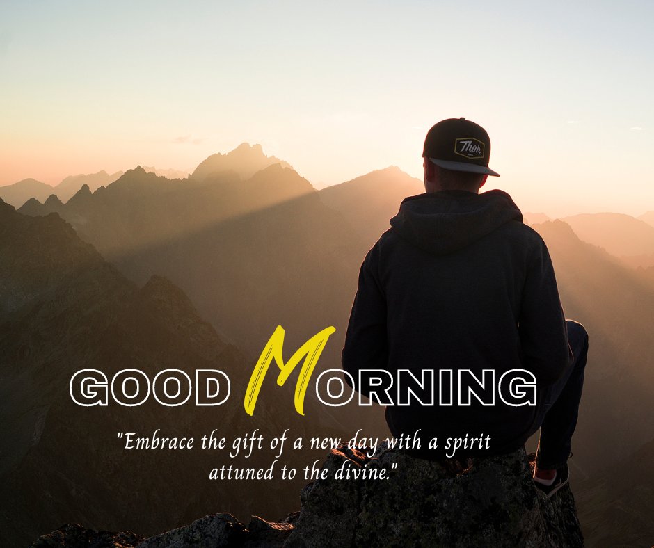 Good morning blessings image featuring a man seated on a mountain peak at sunrise, overlooking a range of sharp silhouettes against a glowing sky. The image includes the phrase "Good Morning" in large yellow letters and an inspirational quote about embracing the new day.