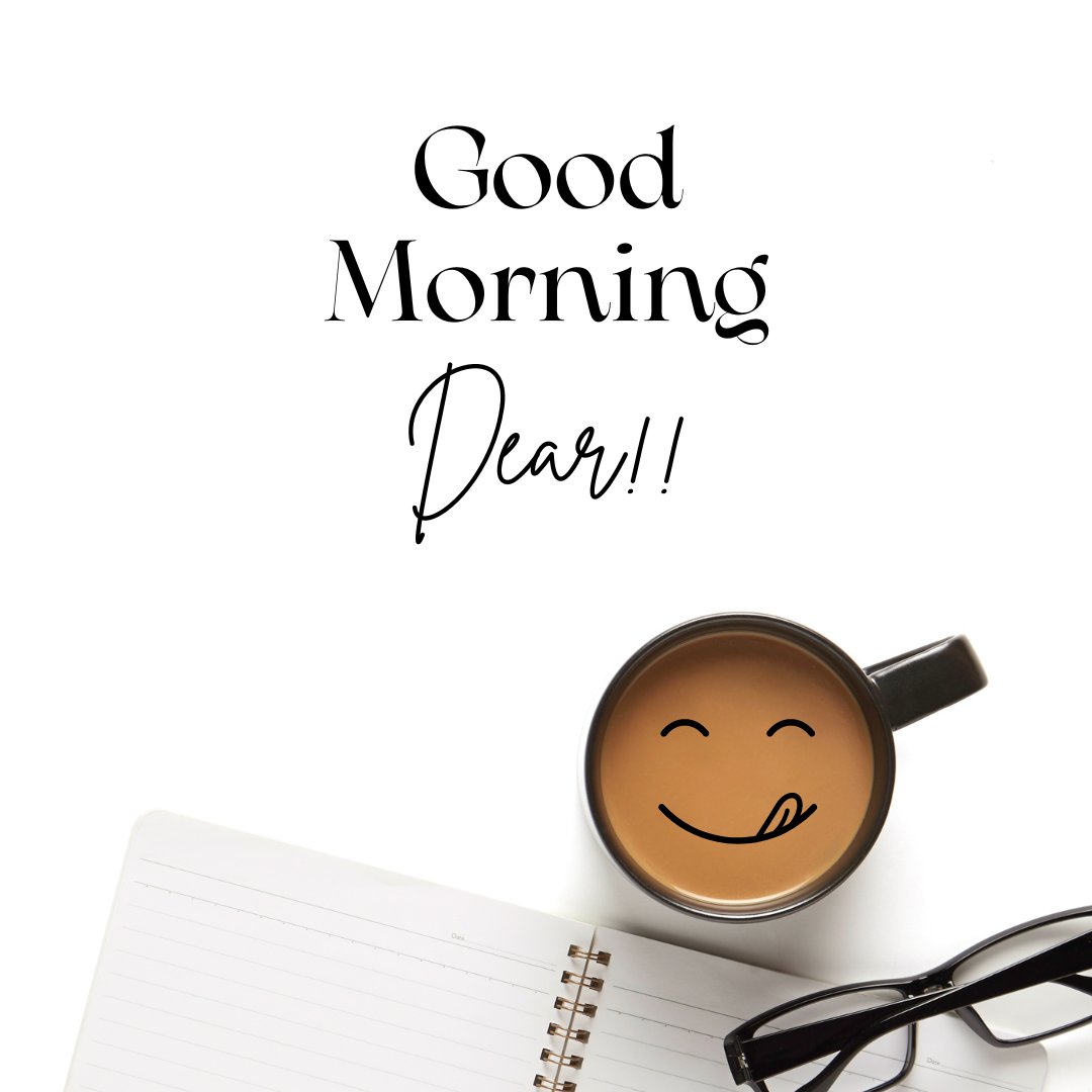 Good morning dear image featuring a top view of a desk with a cheerful coffee mug with a smiling face, a notebook, and glasses, alongside the scripted greeting 'Good Morning Dear!!'.